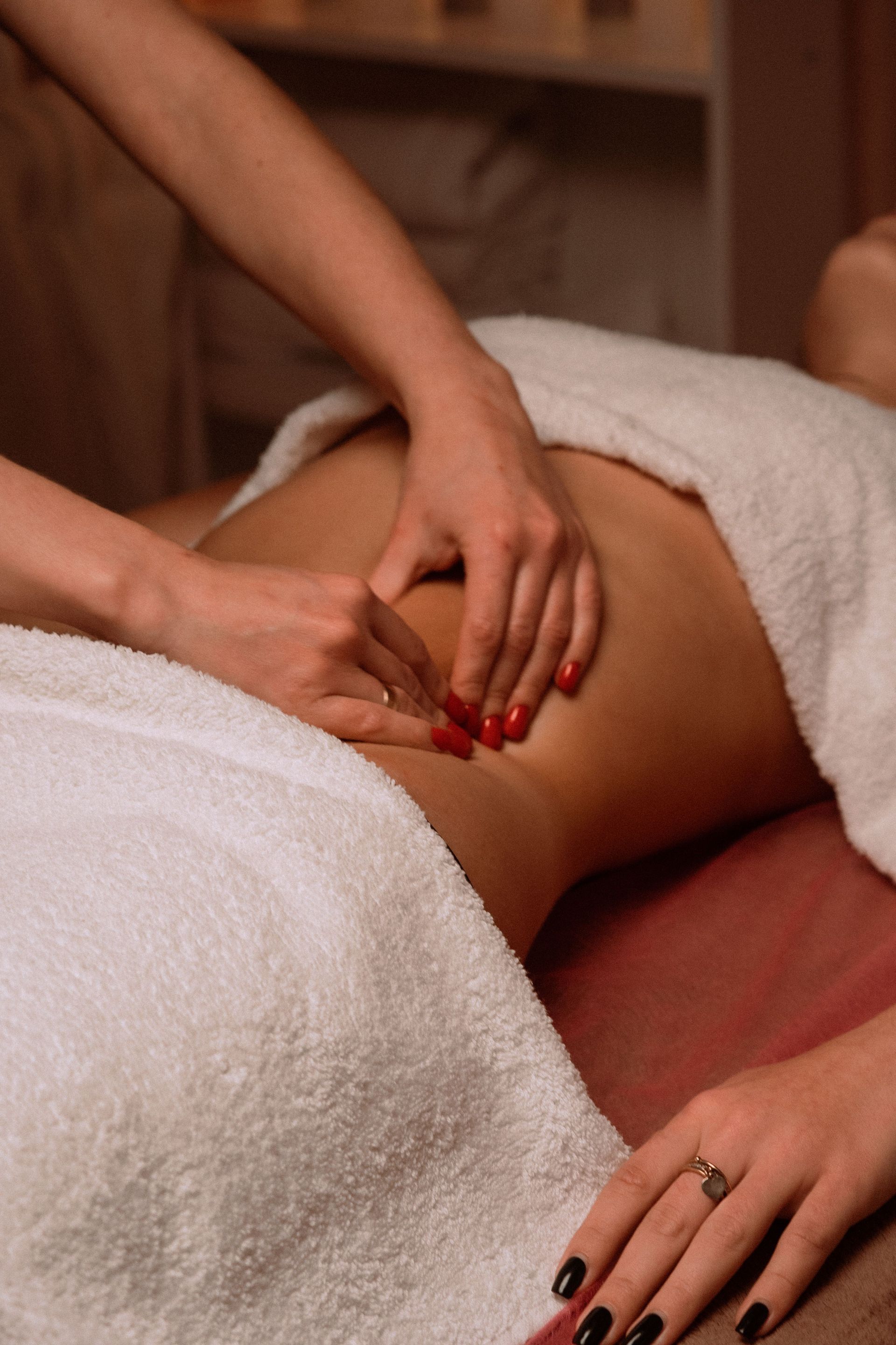 Close-up of therapist giving a soothing massage, capturing relaxation.
